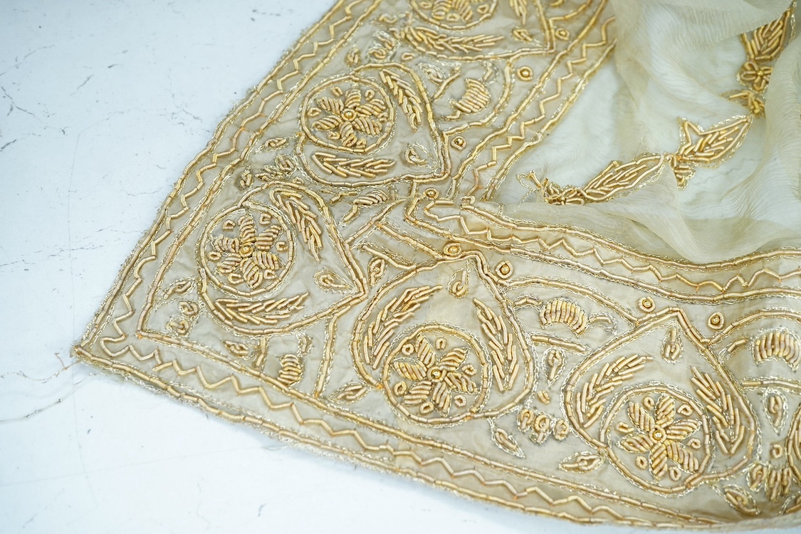 An Indian silk and metallic gold thread embroidered wall hanging, possibly for a wedding. Condition - fair/good
